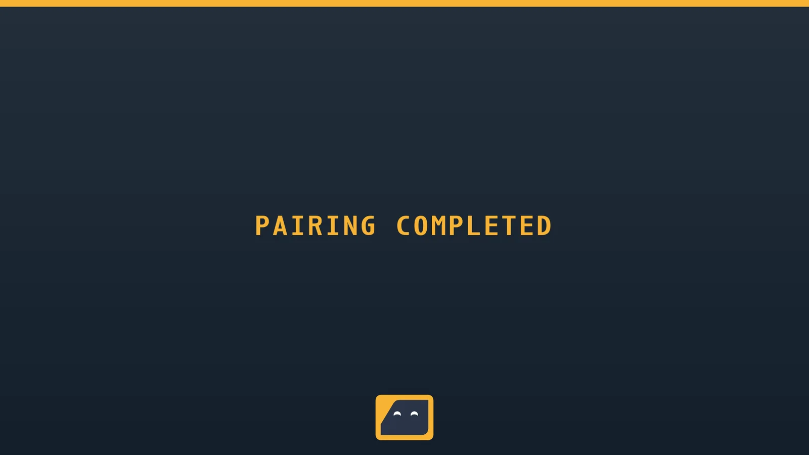 The pairing confirmation: PAIRING COMPLETED in amber letters on a dark gradient with a small smiling logomark at the bottom